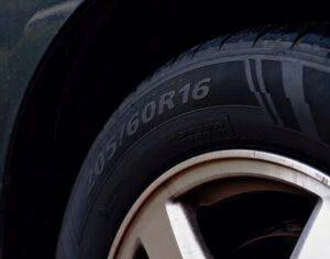 A close-up of a car tire and wheel.