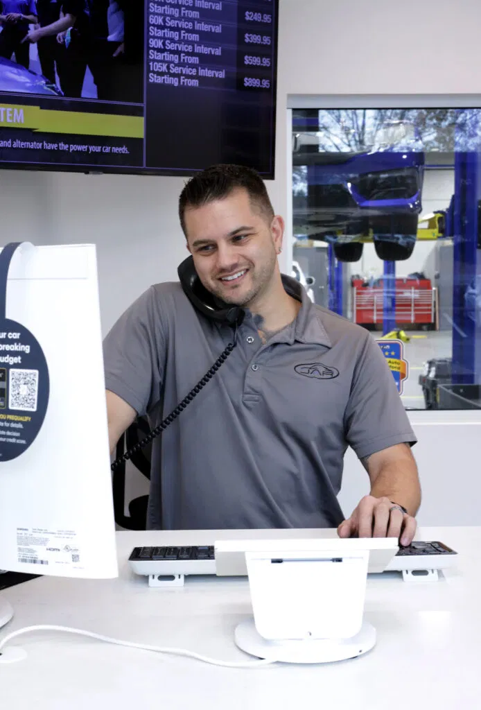 car mechanic tech answering the phone