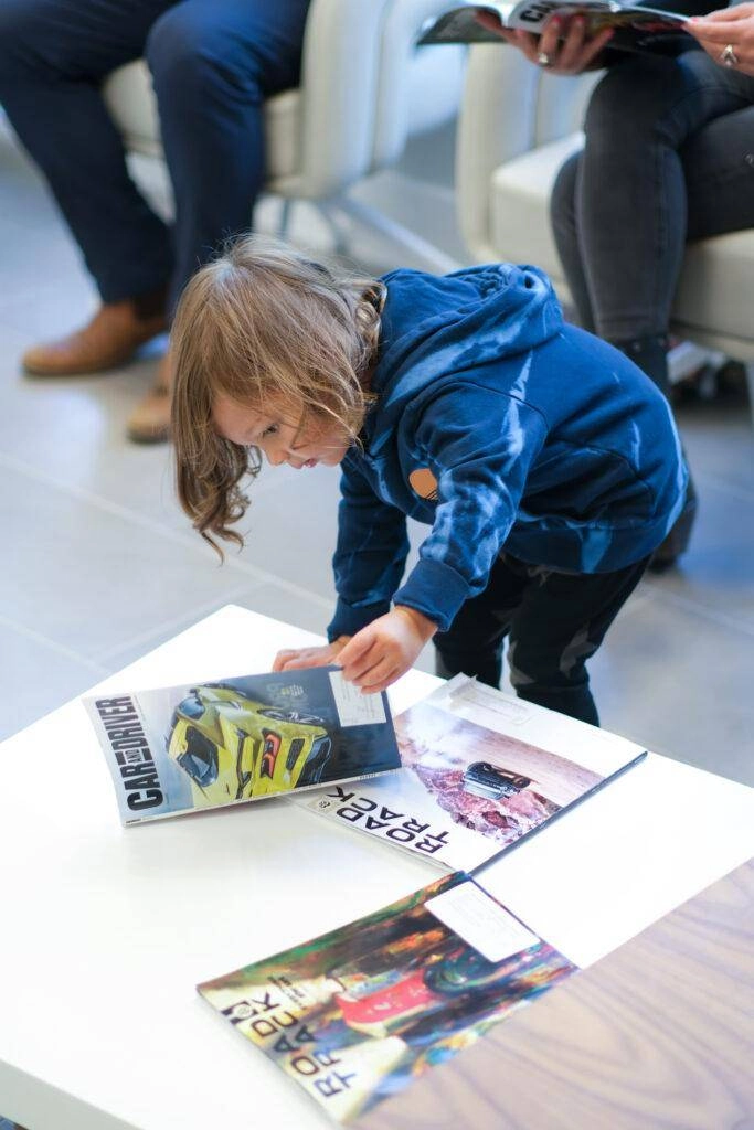 Child Waiting in the Car Shop Lobby