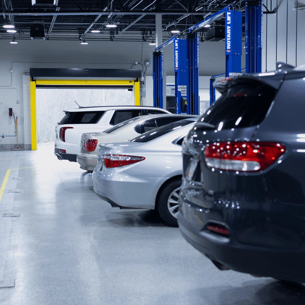 four vehicles getting auto repair service