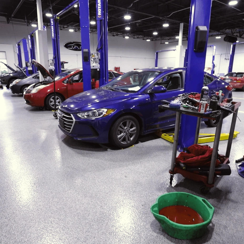 different makes of cars getting auto service