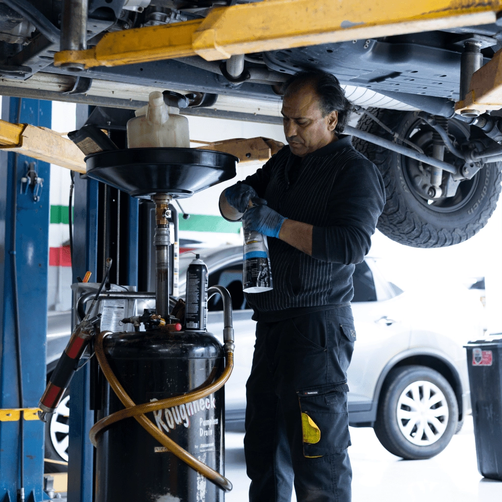 mechanic actively opening or closing an auto repair product